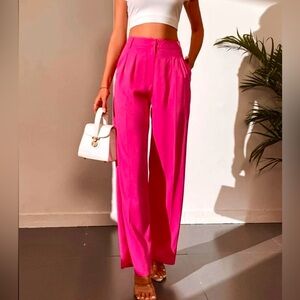 Nasty Gal fuchsia pink high-waisted pleated wide-leg pants.